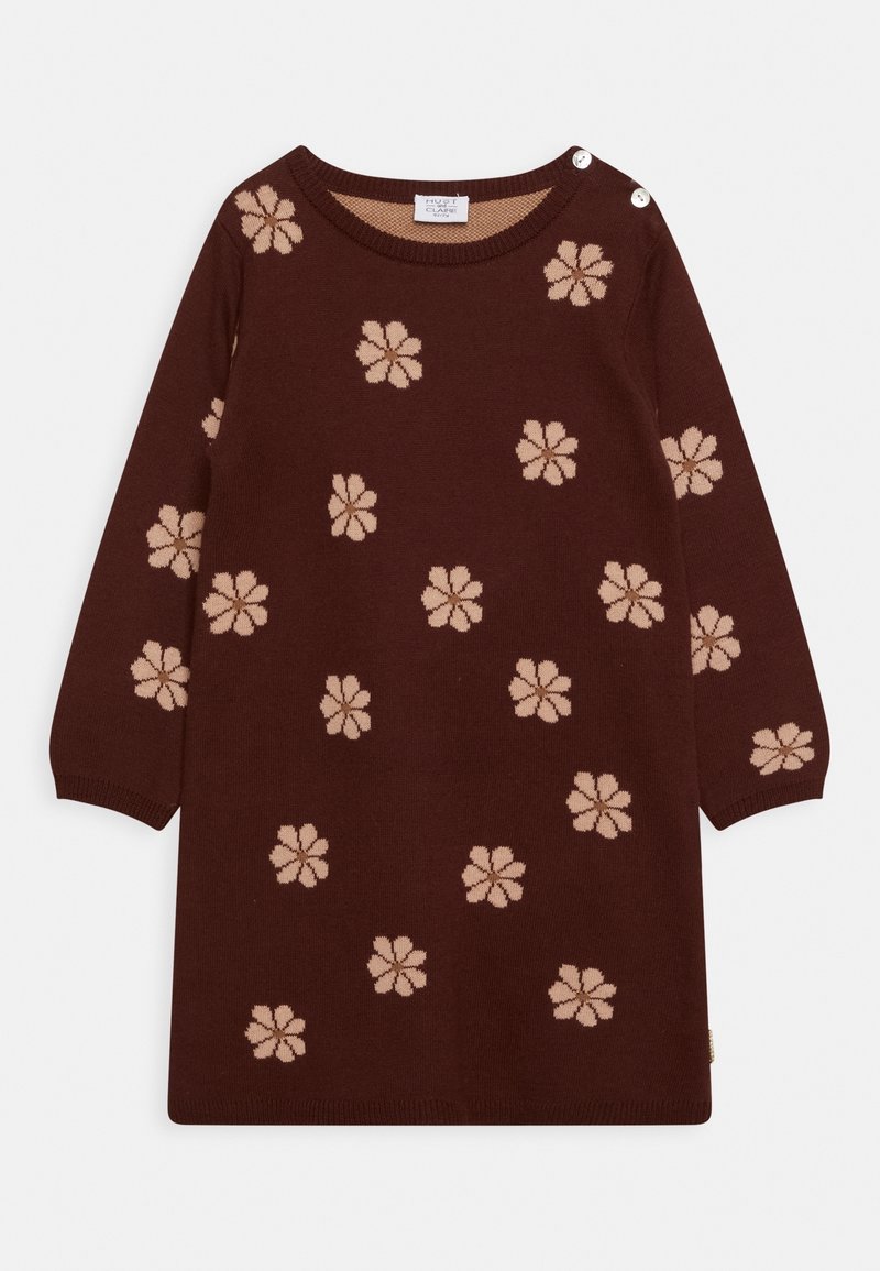 Robe marron à manches longues avec motifs floraux beiges et deux boutons blancs sur l'épaule gauche, col rond.
