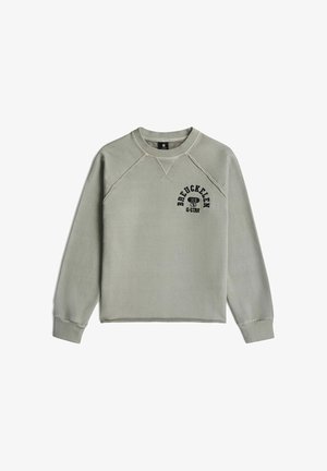 Sweat-shirt gris clair à col rond avec poignets côtelés, coutures aux épaules et texte noir imprimé "BREUCKELLEN 89 G-STAR" sur la poitrine gauche.