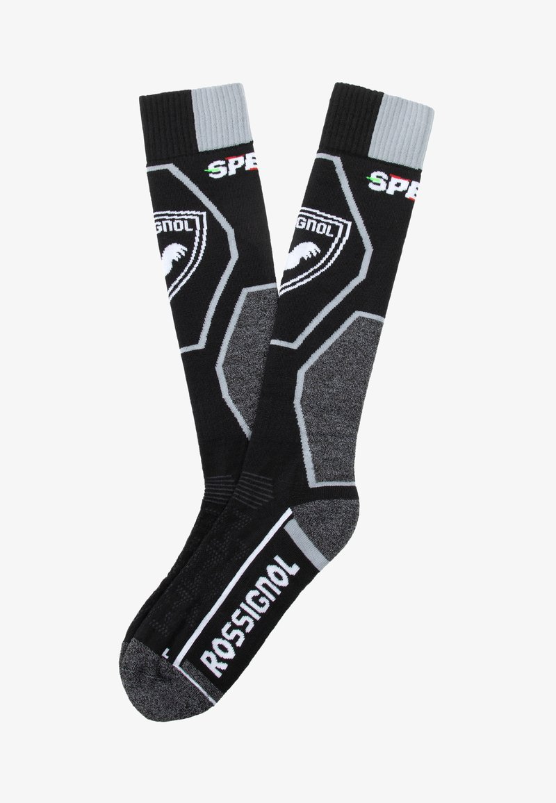 Calcetines de esquí negros con acentos grises, patrones hexagonales y el logo de "Rossignol". Puño acanalado para un ajuste ceñido. Textura suave.