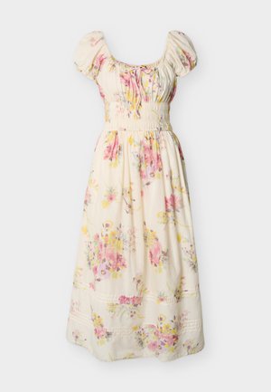 Κρεμ midi φόρεμα με ροζ και κίτρινο λουλουδάτο σχέδιο, φουσκωτά μανίκια, ρυτιδωμένη μέση και λεπτομέρεια δέσιμου στη στρογγυλή λαιμόκοψη.