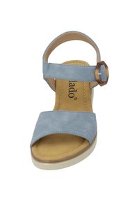 Blue sandal with a suede texture, adjustable strap, and brown buckle accent. Features a cushioned insole and lightweight sole.