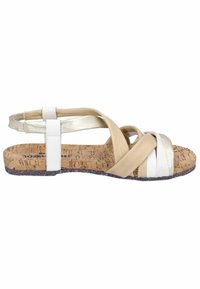 Sandali piatti con cinturini multicolore in beige e bianco, dotati di un plantare in sughero e una suola testurizzata e decorata con accenti colorati.