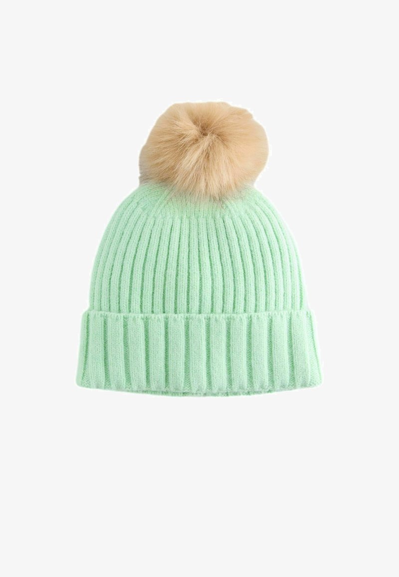 Heleroheline õmmeldud beanie müts soonilise tekstuuriga ja ülaosas pruun karvaga pom-pom. Alumises osas lisatud stiili saavutamiseks voltisääre kujundus.