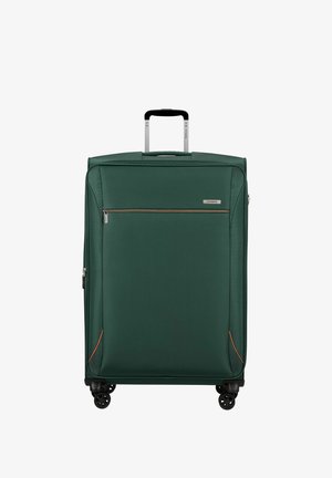 Grande valise souple vert foncé avec poignée télescopique argentée étendue, poche zippée avant et quatre roues pivotantes noires.
