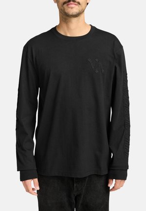 Zwarte lange mouwen T-shirt van katoen, met een subtiele 3D-logo op de borst en tekst gedrukt langs één mouw. Klassieke pasvorm.