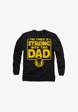 Schwarzes Langarm-T-Shirt mit auffälligem gelbem Text: „DIE KRAFT IST STARK MIT DIESEM VATER“ und einem runden Jedi-Symbol am unteren Rand.