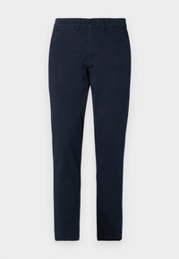 Námořnické modré chinos kalhoty vyrobené z bavlněné tkaniny, úzký střih, se zipem a knoflíkovým zapínáním, s poutky na opasek a bočními kapsami.