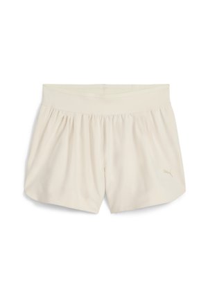 Puma shorts in light cream, made of soft fabric, featuring a wide elastic waistband and a subtle logo in the lower corner.