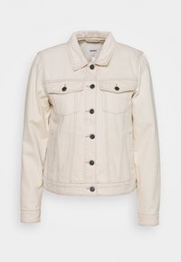 Cremefarvet denimjakke med krave, lange ærmer, to brystlommer, seks sorte knapper og synlige stikninger.