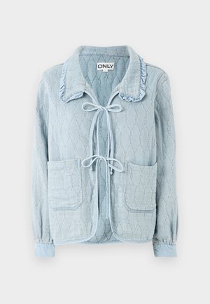 Light blue denim jacket with a textured, diamond pattern. Features a ruffled collar, front tie closure, and two front pockets.