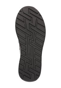 Schwarze Gummisohle mit einem strukturierten Profilmuster, das Zickzack-Rillen aufweist und ein eingeprägtes Logo an der Seite hat.