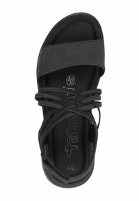 Black sandal with an open toe, featuring crisscross straps and a smooth texture. Insole displays brand name. Size marked as 37.