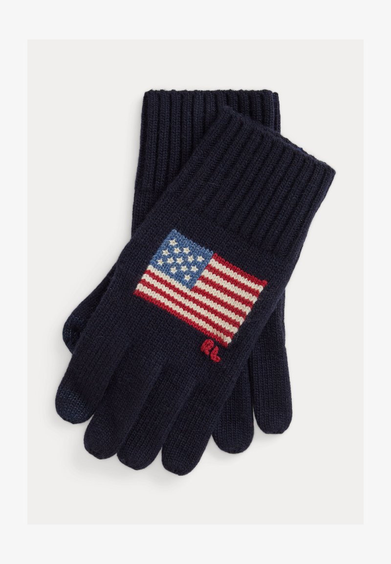 Tamsiai mėlynos megztos pirštinės pasižymi ryškiai matomu Amerikos vėliavos dizainu, su raudonomis ir baltomis juostelėmis bei mėlynu lauku su baltomis žvaigždėmis.