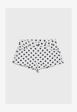Pantaloncini in denim bianco con pois neri, chiusura frontale con bottone e zip, passanti per cintura e tasche anteriori e posteriori.