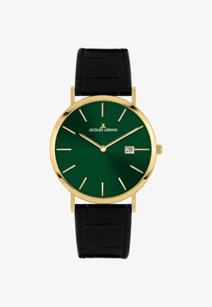 Gouden horloge met een diep groene wijzerplaat, langwerpige uurmarkeringen, datumaanduiding op zes uur, en een zwarte leerband met krokodillenpatroon.