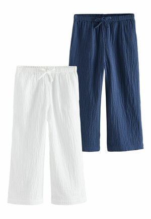 Two pairs of textured cotton pants, one white and one navy blue, both with elastic waistbands and drawstring ties.