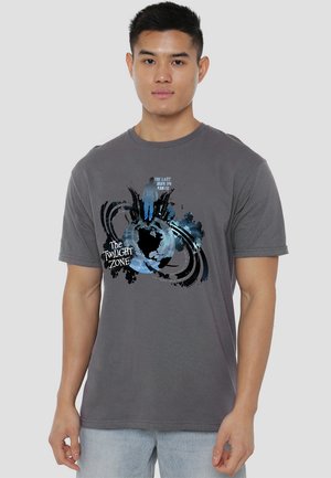 Gray cotton T-shirt featuring a graphic design with a globe and silhouette, text "The Twilight Zone," and splatter accents in blue tones.