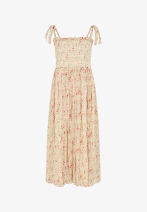 Beiges ärmelloses Maxikleid mit gerafftem Oberteil, gebundenen Schulterträgern und rotem Blumenmuster auf dem fließenden Rock.