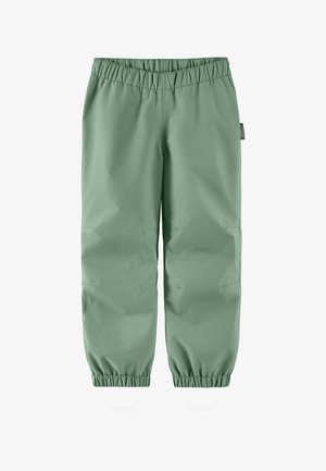Hellgrüne wasserdichte Kinderhose mit elastischem Bund und Bündchen, ausgestattet mit verstellbaren Fußriemen für sicheren Sitz.