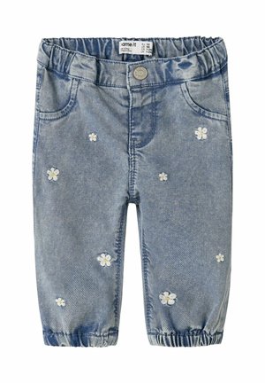 Jasnoniebieskie dżinsy z elastycznym pasem, ozdobione haftowanymi białymi stokrotkami rozsianymi po przodzie oraz elastycznymi mankietami przy kostkach.