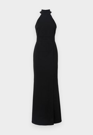 Robe noire à col halter avec un corsage ajusté, une jupe longue et une fente sur le côté. Fabriquée en tissu lisse avec un design épuré et minimaliste.
