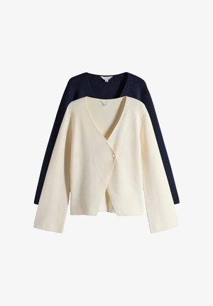 Two ribbed knit cardigans, one cream with a single-button closure in front, and one navy blue layered behind.
