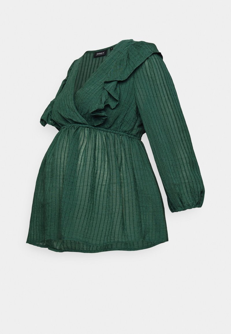 Haut de maternité vert avec un décolleté en V profond et des accents à volants. Le tissu présente un design texturé et plissé. Manches longues ballon.
