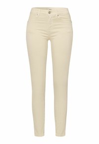 Jeans skinny beige hechos de algodón elástico, con cierre de botón, cinco bolsillos y una textura suave y elegante.