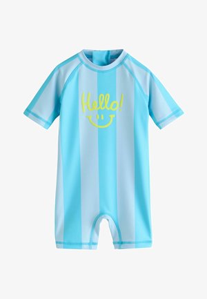 Tutina per neonato a maniche corte con strisce verticali azzurre e testo giallo "Ciao!" sopra una faccina sorridente sul davanti.