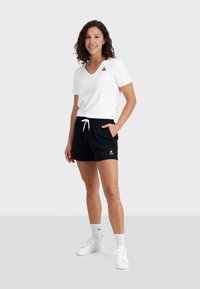 le coq sportif ESSENTIELS - Teplákové kalhoty - black