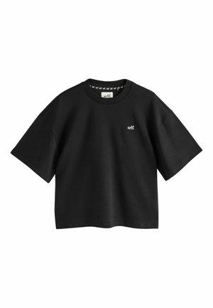 Black cropped t-shirt with short sleeves, made of cotton. Features a small white logo and a round neckline. Smooth texture with minimal detailing.