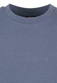 T-shirt en coton bleu avec un col rond, une texture lisse et des coutures régulières. Étiquette visible à l'intérieur du col.