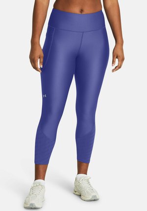 Purple athletic leggings with a high waist, smooth texture, and side pockets. Features tonal brand text along the lower leg.