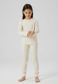 Baumwoll-Pyjama-Set in Creme mit zartem Blumenmuster. Langärmliges Oberteil und figurbetonte Hose mit gerippten Bündchen. Weicher Stoff, leichtes Design.
