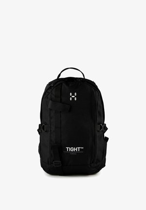 Schwarzer kompakter Rucksack mit Frontgurt, seitlichen Schnallen, Tragegriff oben und dem Text "TIGHT™ X SMALL" auf der unteren Vorderseite.