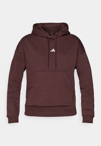 Bordo kapuca s kapuljača iz mehkega materiala, ki ima kenguru žep, vrvico za zategovanje in belo trikotno logo na prsih.