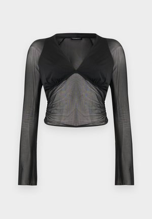 Haut court noir à manches longues avec manches et partie centrale en maille transparente, corsage uni à encolure en V, et détails froncés à la taille.