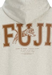 Gray hoodie featuring bold brown "FUJI" lettering, a leaping tiger graphic, and small text with "HEART OF JAPAN HONSHU ISLAND" underneath.