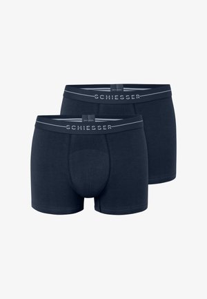 Bóxer azul marino de mezcla de algodón, con un soporte para el área genital, cinturilla elástica con el logo "SCHIESSER" y una textura suave. Se muestran dos pares.