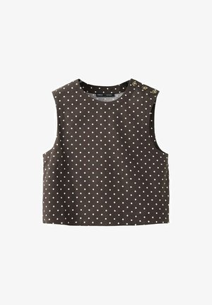 Bruin mouwloos cropped topje met witte polka dots, ronde halslijn en drie decoratieve knopen op de linker schouder.