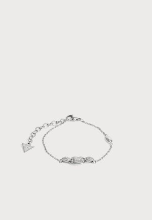 Bracelet délicat en chaîne argent avec un cristal rectangulaire central et deux grappes de petits cristaux de chaque côté, doté d'un fermoir ajustable.