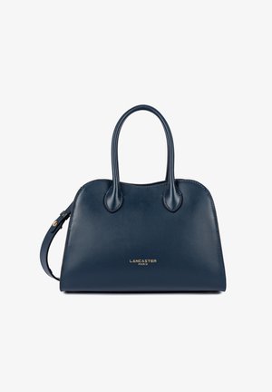 Sac à main en cuir bleu marine avec deux poignées, une bandoulière latérale, et un logo doré "Lancaster Paris" au centre avant.