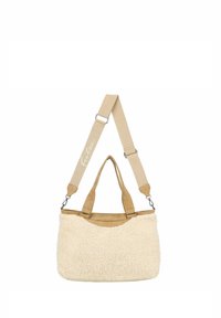 Beige canvas en nepbont tas met dubbele handgrepen en een verstelbare schouderriem. Beschikt over een gladde, gestructureerde body en een subtiel logo op de riem.