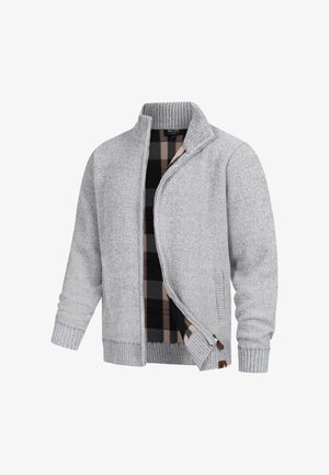 Grå strikket jakke med glidelås, ribbestrikket krage og mansjetter, samt en rutete innerside i sorte, beige og brune toner.