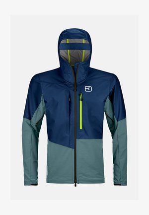 Navy and teal outdoor jacket with a high collar, adjustable hood, and contrasting lime green zippers. Features a sleek, modern design.