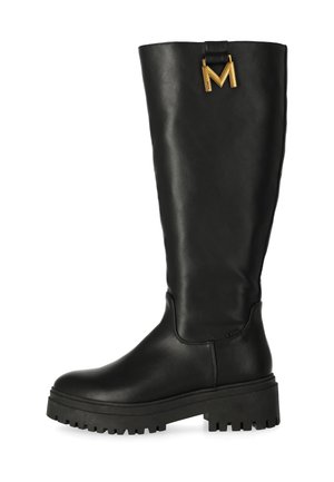 Bottes noires montantes en cuir lisse, avec une semelle épaisse et un accent doré en forme de "M" en haut.