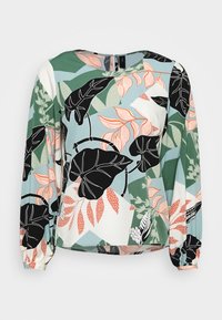 Blusa a maniche lunghe con stampa botanica multicolore, con foglie nere, accenti floreali pastello e una vestibilità morbida. Tessuto dal tocco morbido.
