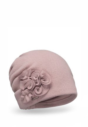 Bonnet rose pâle en laine, orné d'une grande fleur décorative avec des accents courbes sur le côté et d'une petite étiquette logo.