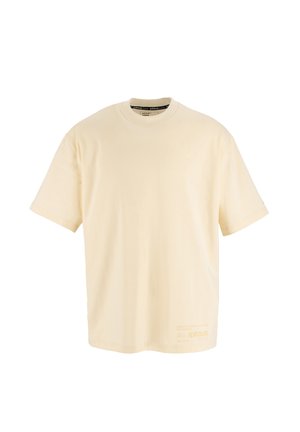 Cremfarbendes, übergroßes T-Shirt aus Baumwolle. Rundhalsausschnitt, kurze Ärmel, mit orangefarbigem Drucktext auf der unteren linken Seite. Glatte Textur.