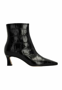 Botte chelsea en cuir noir avec un bout pointu, motif crocodile, finition brillante et un talon conique de hauteur moyenne.